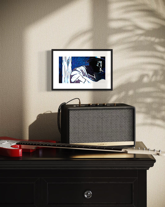 A stylish interior scene featuring a .framed blues player-inspired art print of a musician in dark smokey room, Mississippi John Hurt.   Monochromatic style hanging above a black cabinet with a vintage amp and red and white electric guitar adding a musical theme. Soft shadows from nearby light and plants create shadows on the wall, giving the space a warm, creative, and music-inspired atmosphere