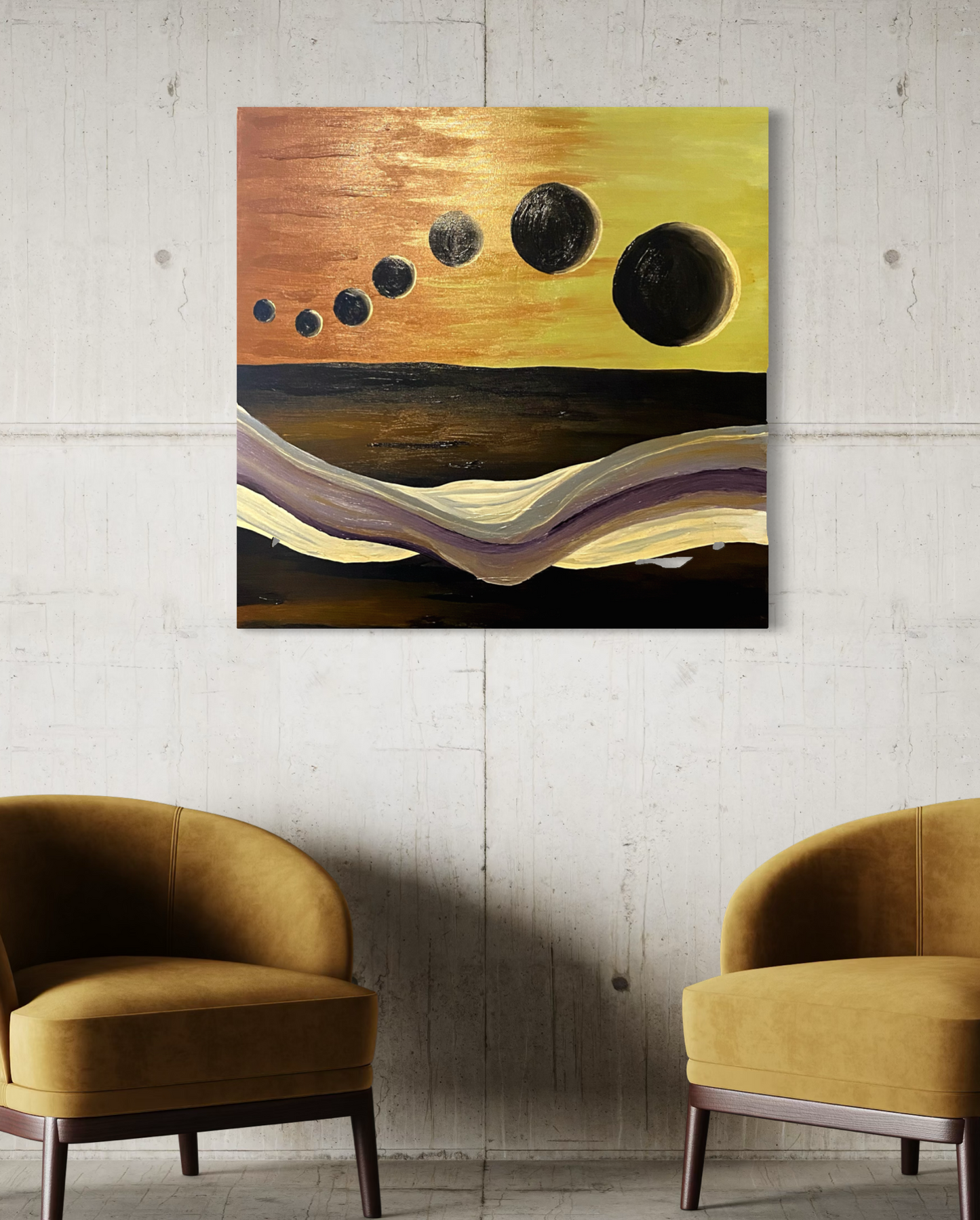 A square abstract wall art print hangs on a light gray concrete wall above two mustard-yellow armchairs. The artwork depicts a warm yellow and orange sky with several dark black celestial circles above layered wavy bands of cream, purple, and black.