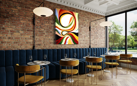 Modern restaurant interior with blue velvet booths, colorful abstract art on brick wall, and wooden tables.