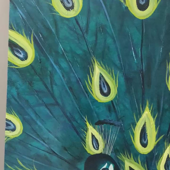 Detailed video showing the painting of a peacock with vibrant colors and detailed feathers.